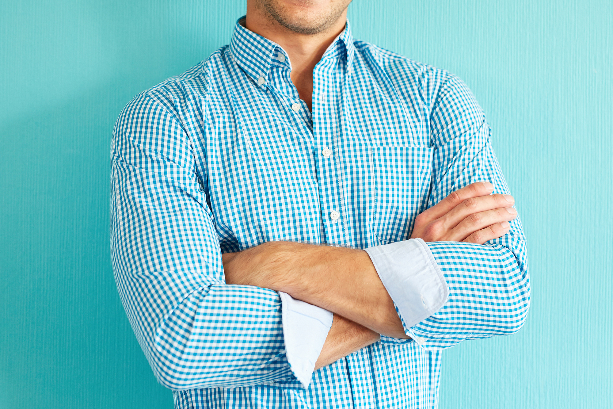 Happy man with crossed arms